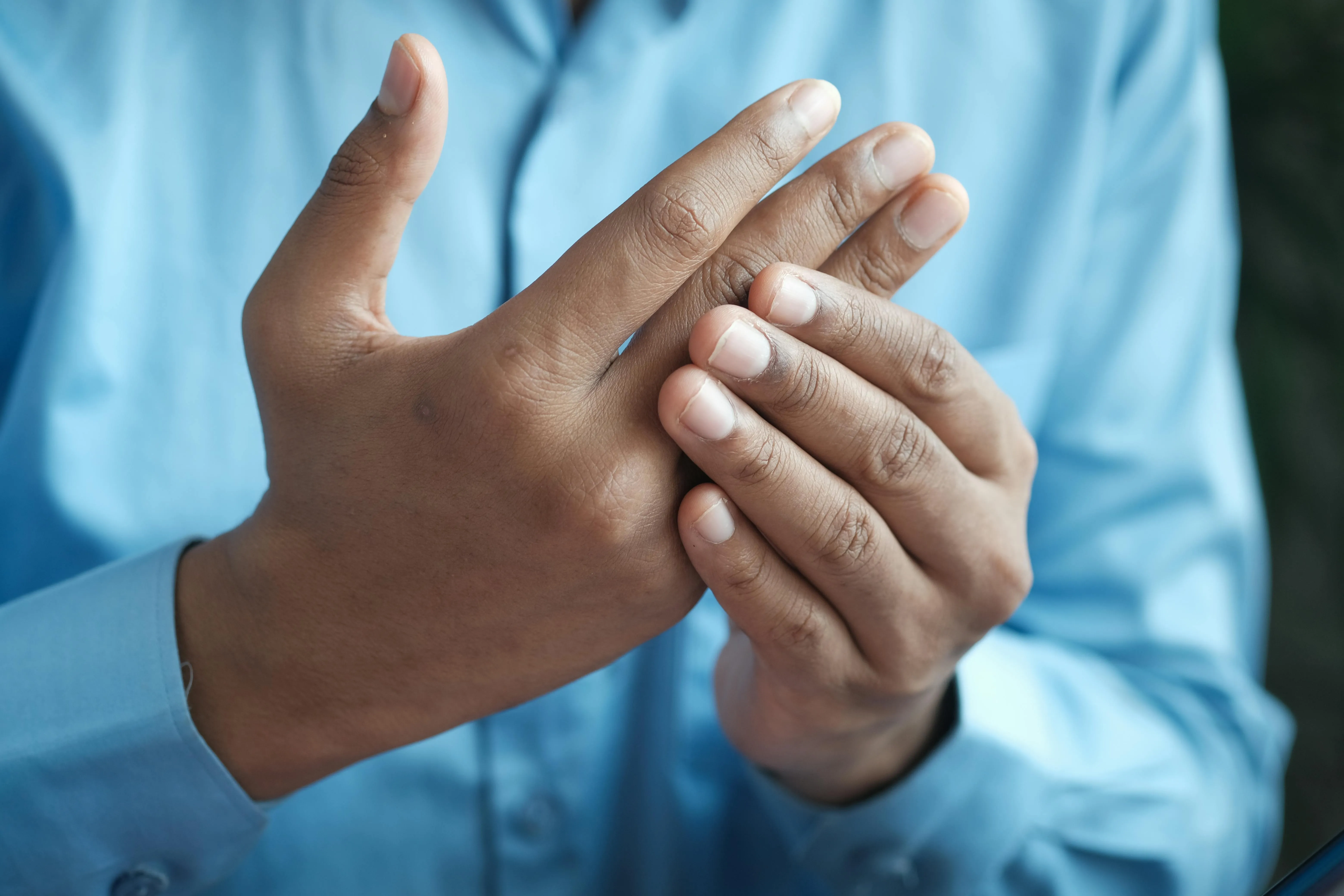 Doctor examining a patient's elbow and forearm